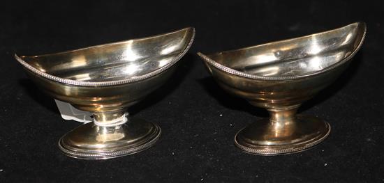 A pair of George III silver navette-shaped pedestal salts, with gadroon borders, London 1785, maker possibly William Skeen